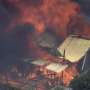 A wildfire in Australia on the outskirts of Perth destroys at least 2 homes and injures 2 people