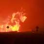 Wildfires tear through western US during heat wave