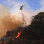 Malibu wildfire grows as thousands still evacuated