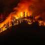 Threat from massive western Canada wildfire eases