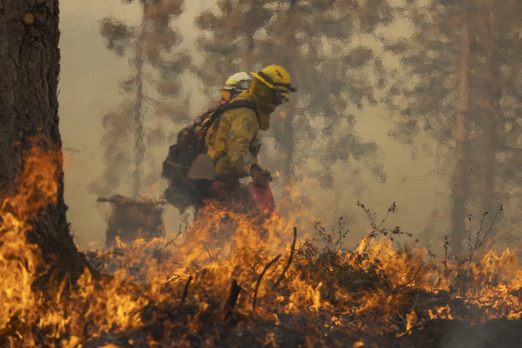 Extreme heat is taking a toll on firefighters as wildfires stretch crews to the limit